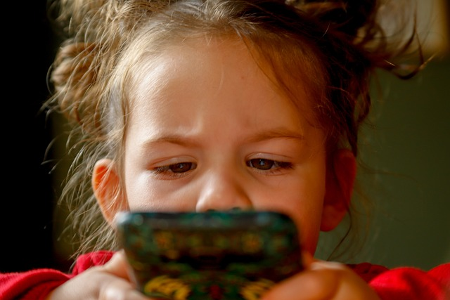 Child getting distracted by mobile phone 